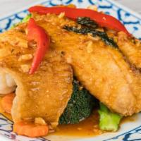 Fillet Fresh Tilapia · Fillet tilapia deep fried topped with onions, scallions, and tomatoes, served with sweet and...