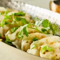 Vegetable Dumpling · Edamame, cabbage, carrot, onion with soy vinaigrette dipping sauce. Vegan.