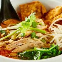 Phuket Noodle Soup · Spicy creamy lemongrass soup base, served with crispy wonton, beansprout, spinach, scallion ...