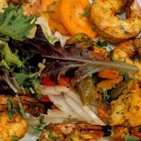 Shrimp Tandoori · Jumbo prawns marinated with a hint of mint and made in clay oven. Served with lemon chutney ...