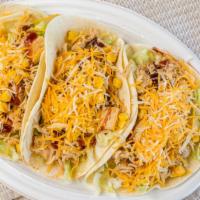 Cowboy Taco · BBQ roasted chicken, corn and cheddar cheese.