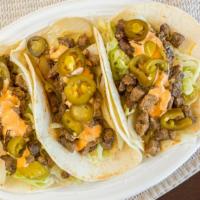 Deer Park Taco · Steak, grilled onions, lettuce, jalapenos, and chipotle aioli.