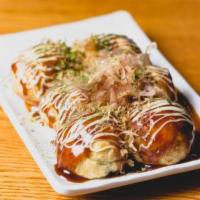 Takoyaki · Six pieces. Grilled octopus balls that are crispy on the outside, soft and doughy on the ins...
