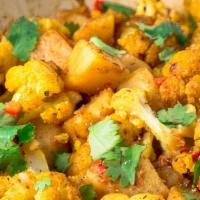 Aloo Gobhi · Vegan, gluten-free. Potatoes, cauliflower florets, ginger, cumin.