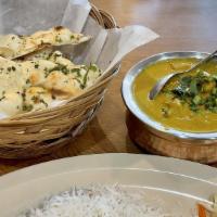 Butter Chicken Combo · world class Butter Chicken served with naan bread, basmati rice, and a side salad