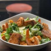 Cajun Shrimp & Salmon Caesar Salad · Grilled Shrimp and Salmon on top of crispy romaine, parmesan, garlic croutons, caesar dressing