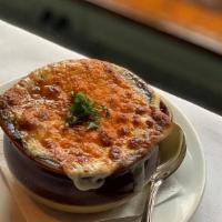 French Onion Soup · Traditional french onion soup w/ carmelized onions, croutons, and melted gruyere cheese