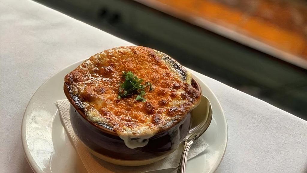 French Onion Soup · Traditional french onion soup w/ carmelized onions, croutons, and melted gruyere cheese