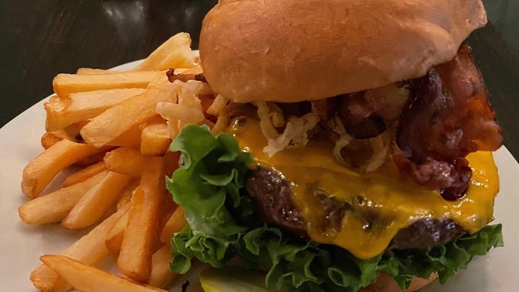 Top Shelf Burger · Short Rib & Sirloin beef blend topped with sharp cheddar chweese, crispy bacon, and our famour crispy fried onions served with fries
