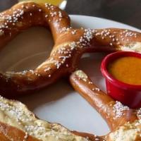 Bavarian Pretzel · Jumbo Bavarian soft pretzel 
served with house-made beer cheese & whole grain mustard
