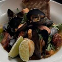 Moqueca Seafood Stew · steamed mussels, salmon, cod fish, and shrimp, in an anchovy & chicken  broth with chorizo, ...