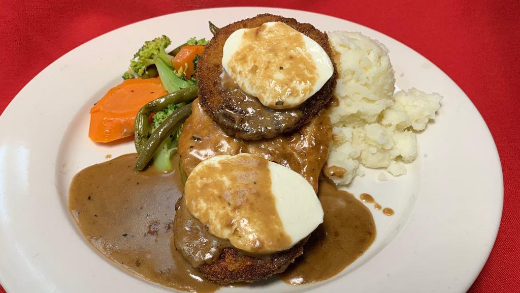 Chicken Mona Lisa · Pan-seared chicken topped with fried eggplant & fresh Mozzarella finished in a balsamic cream sauce, served with mashed potatoes and vegetables of the day.