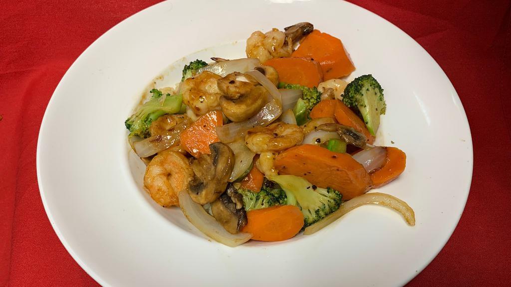 Shrimp Stir Fry · A mix of zucchini, squash, mushrooms, onions, and carrots in teriyaki sauce over rice.