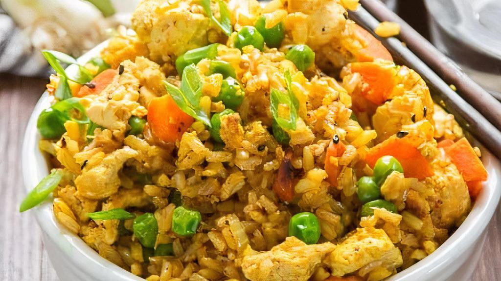 Curry Fried Rice · Stir-fried eggs, green & white onions, peas & carrots mixed with rice