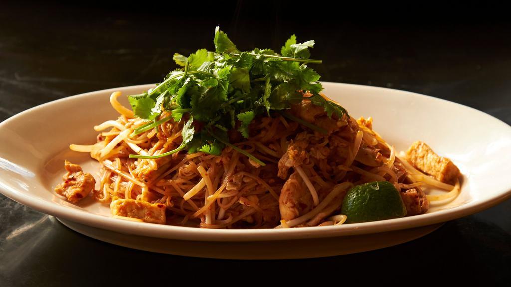 Pad Thai Chicken · Stir-fried rice noodles with chicken, tofu, egg, bean sprouts, topped with crushed peanuts.