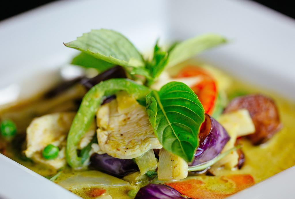 Gang Kiew Wan (Green Curry)* · Choice of meat in green curry paste mixed in coconut milk with bamboo shoots, eggplants, sweet peas, bell peppers, fresh basil.