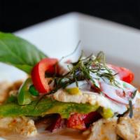 Panang* · Choice of meat in red curry paste mixed in coconut milk with bell peppers, sweet peas, lime ...