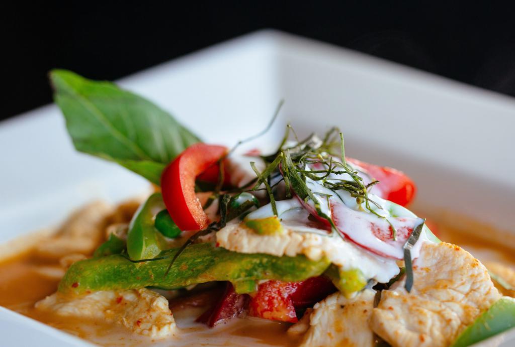 Panang* · Choice of meat in red curry paste mixed in coconut milk with bell peppers, sweet peas, lime leaves.