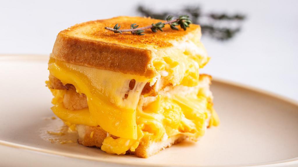 2 Egg And Cheese Sandwich · Classic egg sandwich with melted cheese on your choice of bread.