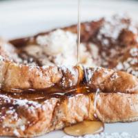 3 Slices Of French Toast · Sliced challah bread soaked in eggs and milk, then fried. Topped with powdered sugar.