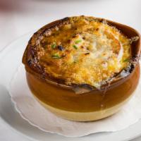 Soupe A L'Onion · Classic French onion soup topped with Gruyère cheese.