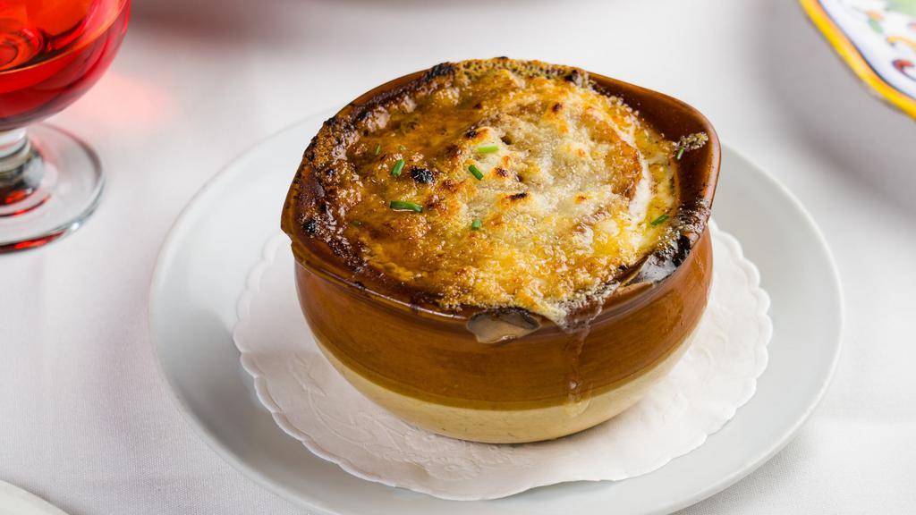 Soupe A L'Onion · Classic French onion soup topped with Gruyère cheese.