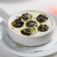 Escargots De Bourgogne · 1/2 doz Burgundy snails on toast, garlic butter parsley sauce.