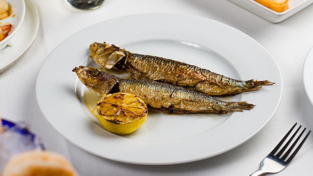 Sardines Grillées · Fresh grilled sardines simply grilled, olive oil, lemon, parsley.
