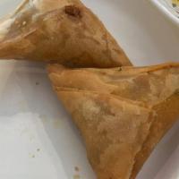 Meat Samosa · Halal. One piece. Deep fried crisp patties stuffed with chicken, onion, and spices.