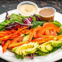 Fetty Wrap · Hummus, avocado, shredded carrots, tomato, cucumber, spring mix, red pepper, balsamic vinaig...