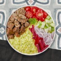 Combo Gyro Over Rice · Customer's choice of two meat mixed with rice and side of salad.