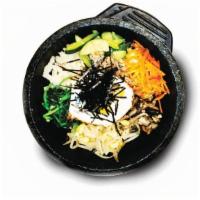 돌솥 비빔밥/ Hot Stone Pot Bibimbap 石锅拌饭 · rice topped w/veggie, bulgogi, egg on the hot stone pot.