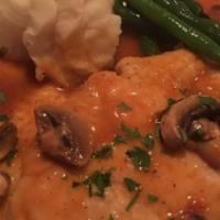Chicken Marsala · Sauteed thinly sliced chicken breast in a mushroom veal stock reduction and Italian Marsala ...