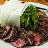 Tagliata Toscano · Grilled or pan seared thinly sliced skirt steak with arugula and aged balsamic vinaigrette.