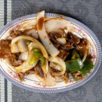 Pepper Steak With Onions · With white rice.