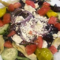 Greek Salad · Artichokes, olives, feta cheese, cucumber, onions, peppers, tomatoes, and Greek dressing.