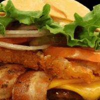 Waikiki Burger · Our Sweet Teriyaki Sauce, Crispy Bacon, Cheddar Cheese, and topped with a hashbrown!