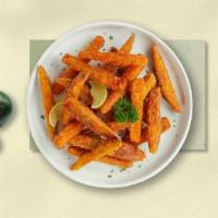 Sweet Potato Fries · Thick-cut sweet potato wedges fried until golden brown