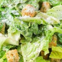 Caesar Salad · A bed of romaine lettuce tossed with a Caesar dressing.