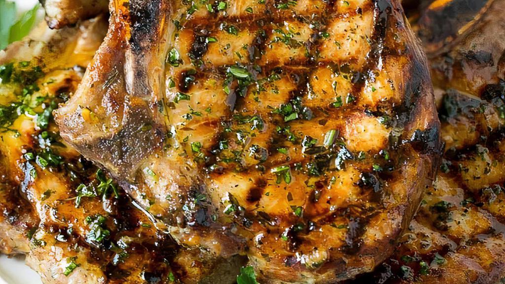 Twin Grilled Pork Chops  · Two grilled center cut pork chops finished with a cranberry demi glace.