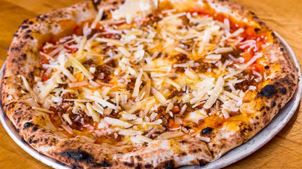 Pizza Bolognese · Shaved Parmigiano Reggiano, Mozzarella, Beef Bolognese Ragu, Tomato Sauce