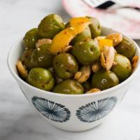 Olives · Warm, Marinated Castelvetrano Olives & Marcona Almonds.