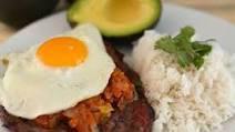A Caballo · Two eggs, steak with sauce ranchera, rice and sweet plantain.