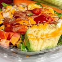Cobb Salad · Romaine lettuce, avocado, tomato, bacon, feta cheese, eggs, grilled chicken.
