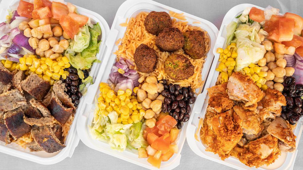 Combo Over Rice  · Combine any two items: 
Chicken, lamb, fish or vegetarian falafel boles
Comes with rice and salad