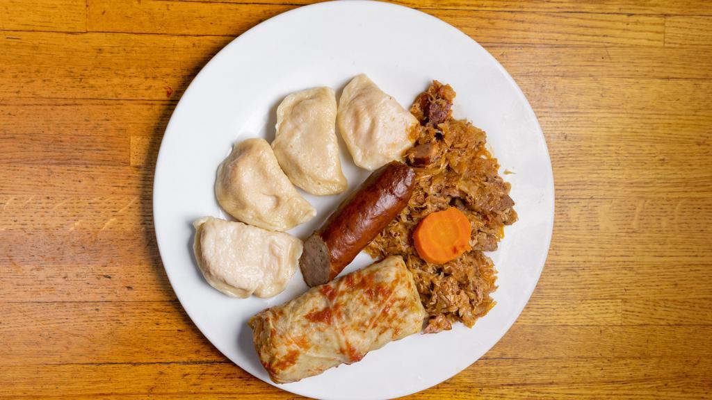 Combination Platter · Includes 4 pierogies, 1 stuffed cabbage, kielbasy, and bigos.