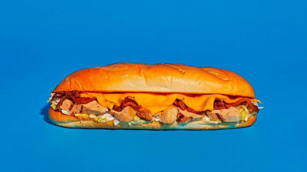 Bacon Ranch Chicken Cheesesteak · Sliced chicken with melted cheddar, crispy bacon, and creamy ranch on a hoagie roll.