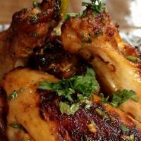 Sami'S Chicken Wings · Oven baked chicken wings with a honey and provençal herb marinade served with side of homema...