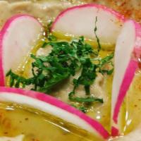 Hummus · Chickpea and tahini dip served with warm pita.