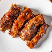 Spare Ribs · With hickory BBQ sauce.